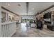 Open concept living space with exposed beams, fireplace, and large windows at 21987 E Stacey Rd, Queen Creek, AZ 85142