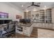 Home office with built-in shelving, granite desk, and hardwood floors at 21987 E Stacey Rd, Queen Creek, AZ 85142