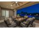 Relaxing covered patio with fire pit and seating at 21987 E Stacey Rd, Queen Creek, AZ 85142