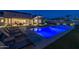 Inviting pool area with lounge chairs and landscape lighting at 21987 E Stacey Rd, Queen Creek, AZ 85142