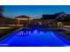 Relaxing pool and patio with lights at dusk at 21987 E Stacey Rd, Queen Creek, AZ 85142