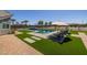 Stunning pool and spa area with artificial turf and brick pavers at 21987 E Stacey Rd, Queen Creek, AZ 85142