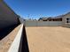 Fenced backyard offering privacy and potential for outdoor activities at 22541 W Pontiac Dr, Surprise, AZ 85387