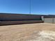 Expansive backyard with block fencing, ready for customization at 22541 W Pontiac Dr, Surprise, AZ 85387