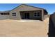 Large backyard with a covered patio and a fresh canvas for landscaping at 22541 W Pontiac Dr, Surprise, AZ 85387