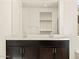 Double vanity in bathroom with large mirror and view of closet at 22541 W Pontiac Dr, Surprise, AZ 85387