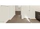 Hallway leading to bedroom with wood-style floors and white walls at 22541 W Pontiac Dr, Surprise, AZ 85387