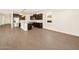 Kitchen featuring stainless steel appliances, center island, and dark wood-look cabinets at 22541 W Pontiac Dr, Surprise, AZ 85387
