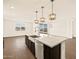 This kitchen features a large island, stainless steel appliances, and an open-concept design at 22541 W Pontiac Dr, Surprise, AZ 85387
