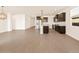 Open-concept kitchen with stainless steel appliances, dark cabinets, and a center island at 22541 W Pontiac Dr, Surprise, AZ 85387