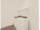 Laundry room with white washer and dryer and storage shelves at 22541 W Pontiac Dr, Surprise, AZ 85387