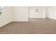 Open-concept living room with wood-look tile floors and modern lighting fixtures at 22541 W Pontiac Dr, Surprise, AZ 85387
