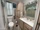 Cozy bathroom with a shower and neutral colored cabinets at 2271 S Seminole Dr, Apache Junction, AZ 85119