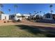 Mobile home community with palm trees and landscaped yards at 2271 S Seminole Dr, Apache Junction, AZ 85119