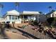 Mobile home exterior with covered porch and landscaped yard at 2271 S Seminole Dr, Apache Junction, AZ 85119