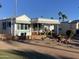 Mobile home with covered patio and rock landscaping at 2271 S Seminole Dr, Apache Junction, AZ 85119