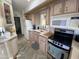 Kitchen with wood cabinets, stainless steel appliances at 2271 S Seminole Dr, Apache Junction, AZ 85119