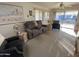 Cozy living room featuring neutral walls, plush carpeting, and comfortable seating arrangement at 2271 S Seminole Dr, Apache Junction, AZ 85119