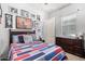 Baseball-themed bedroom with full-size bed and dresser at 22917 E Camina Buena Vis, Queen Creek, AZ 85142