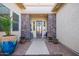 Welcoming entryway with stone pillars and potted plants at 22917 E Camina Buena Vis, Queen Creek, AZ 85142