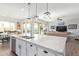 Spacious kitchen island with double sink and granite countertop at 22917 E Camina Buena Vis, Queen Creek, AZ 85142