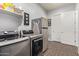 Laundry room with washer, dryer, and storage at 22917 E Camina Buena Vis, Queen Creek, AZ 85142