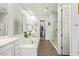 Main bathroom with soaking tub, double vanity, and walk-in shower at 22917 E Camina Buena Vis, Queen Creek, AZ 85142