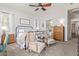 Main bedroom with two armchairs, dresser, and large bed at 22917 E Camina Buena Vis, Queen Creek, AZ 85142