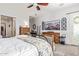 Main bedroom with dresser, large bed, and mountain artwork at 22917 E Camina Buena Vis, Queen Creek, AZ 85142