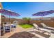 Relaxing patio area with seating and umbrellas at 22917 E Camina Buena Vis, Queen Creek, AZ 85142