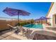 Inviting backyard oasis with a refreshing pool and patio at 22917 E Camina Buena Vis, Queen Creek, AZ 85142