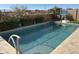 Inviting backyard pool with a basketball hoop nearby at 22917 E Camina Buena Vis, Queen Creek, AZ 85142