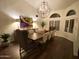 Elegant dining room featuring a large wooden table, chandelier, and hardwood floors at 2305 Fox Tail --, Carefree, AZ 85377