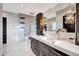 Elegant bathroom featuring a double vanity and mosaic tile at 24258 N 91St St, Scottsdale, AZ 85255