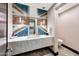 Stylish powder room with unique mosaic tile feature at 24258 N 91St St, Scottsdale, AZ 85255