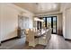 Elegant dining room featuring a large marble table and access to a patio at 24258 N 91St St, Scottsdale, AZ 85255