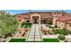 Front view of a large, beautiful home with a tiled pathway at 24258 N 91St St, Scottsdale, AZ 85255