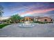 Luxury home with circular driveway and central fountain at 24258 N 91St St, Scottsdale, AZ 85255