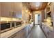 Secondary kitchen with brick accent wall and modern appliances at 24258 N 91St St, Scottsdale, AZ 85255