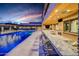 Granite outdoor kitchen with bar seating and pool views at 24258 N 91St St, Scottsdale, AZ 85255