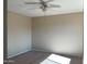 Bedroom with ceiling fan and carpeted floor at 2429 E Calypso Ave, Mesa, AZ 85204