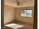 Well-lit bedroom with plush carpeting and ceiling fan at 2429 E Calypso Ave, Mesa, AZ 85204