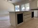 Spacious kitchen with island and sliding glass doors at 2429 E Calypso Ave, Mesa, AZ 85204