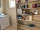 Laundry area with shelving and additional storage at 2429 E Calypso Ave, Mesa, AZ 85204