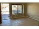 Living room with tile flooring and view of front yard at 2429 E Calypso Ave, Mesa, AZ 85204