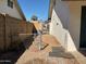 Side yard with chain link fence and storage at 2429 E Calypso Ave, Mesa, AZ 85204