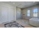 Contemporary bathroom boasts glass shower, soaking tub, and neutral tile at 24642 N 123Rd Pl, Scottsdale, AZ 85255