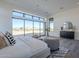 Comfortable bedroom featuring expansive window, plush seating, and stylish decor at 24642 N 123Rd Pl, Scottsdale, AZ 85255