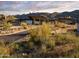 Desert landscape with modern clubhouse in background at 24642 N 123Rd Pl, Scottsdale, AZ 85255