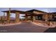 Stone and glass clubhouse entrance with mountain views at 24642 N 123Rd Pl, Scottsdale, AZ 85255